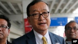 In this photo taken on Nov. 14, 2019, Cambodia's exiled opposition leader Sam Rainsy talks to the media upon arrival at Soekarno-Hatta International Airport in Tangerang, Indonesia.