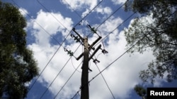 FILE - A utility pole supporting wires for electricity distribution is seen in Nairobi, Kenya. Taken November 11, 2015