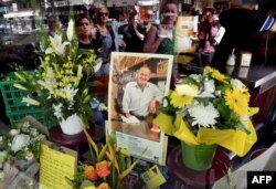 FILE - People pay their respects for Sisto Malaspina, who was killed Nov. 9, 2018, in a stabbing attack in Melbourne. Malaspina, 74, an icon of Melbourne's thriving culinary culture, was killed by Somali-born Australian Hassan Khalif Shire Ali.