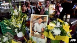 People pay their respects for Sisto Malaspina, who was killed Nov. 9, 2018, in a stabbing attack in Melbourne. Malaspina, 74, an icon of Melbourne's thriving culinary culture, was killed by Somali-born Australian Hassan Khalif Shire Ali.