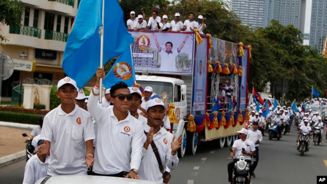 Supporters of Cambodian Prime Minister Hun Sen's People's Party start a campaign in Phnom Penh, Cambodia, Saturday, July 7, 2018.