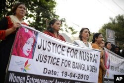 FILE - Protesters demand justice for Nusrat Jahan Rafi, who was killed after she was set on fire for refusing to drop sexual harassment charges against her Islamic school's principal, in Dhaka, Bangladesh, April 19, 2019.