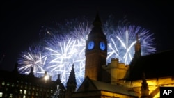 Fireworks explode over the River Thames and the Palace of Westminster's Elizabeth Tower, known as Big Ben, as the New Years Day celebrations begins in London, Friday, Jan. 1, 2016.
