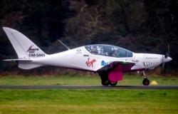 Belgium-British teenage pilot Zara Rutherford lands with her Shark ultralight plane at the Egelsbach airport in Frankfurt, Germany, Jan.19, 2022.