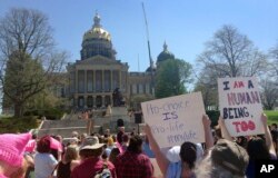 Planned Parenthood supporters rally outside the Iowa Capitol Building in Des Moines, Iowa, May 4, 2018.