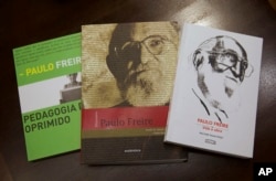 This Feb. 5, 2019 photo shows three books by Paulo Freire at a public library, in Rio de Janeiro, Brazil. (AP Photo/Silvia Izquierdo)