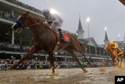 FILE - In this May 5, 2018 file photo, Mike Smith rides Justify to win the 144th Kentucky Derby in Louisville (AP Photo / Morry Gash, file)