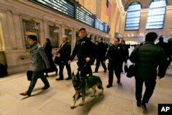 Metro-North Railroad police officers patrol Grand Central Terminal, in New York, March 22, 2016.