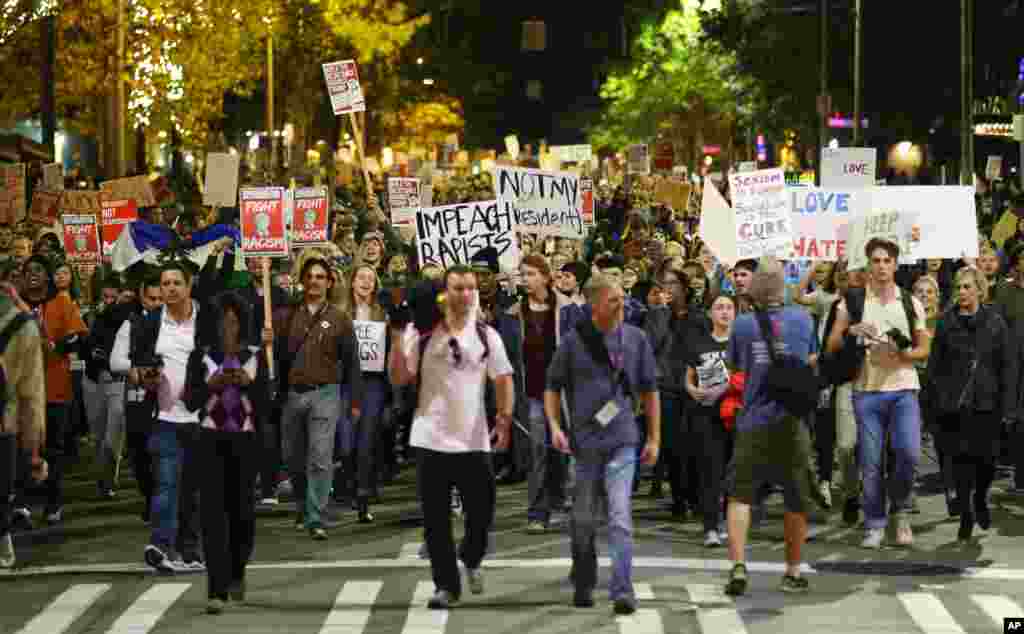 Hundreds of protesters march in downtown Seattle as they protest the election of President-elect Donald Trump, Nov. 9, 2016.