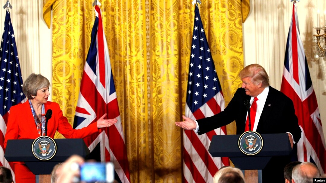 FILE - British Prime Minister Theresa May and U.S. President Donald Trump during their joint news conference at the White House in Washington, Jan. 27, 2017. Both the Trump presidential campaign and the Brexit campaign used Big Data to reach voters.