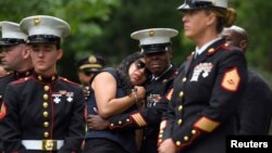 Fellow Marines who served in Bahrain with Marine Corps Sgt. Johanny Rosario Pichardo, who was among 13 U.S. service members killed in the airport suicide bombing in Afghanistan's capital Kabul, pay their respects in her hometown in Lawrence, Massachusetts on Sept. 14, 2021.