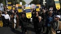 FILE - Iranian protesters chant slogans in an anti-U.S. rally in Tehran, Iran, Sept. 22, 2017. The protesters condemned President Donald Trump's remarks at the United Nations, calling Iran a "corrupt dictatorship" and a "murderous regime," and said the landmark nuclear agreement Tehran reached with the U.S. and other world powers was "an embarrassment to the United States."