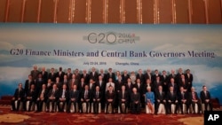 G20 Finance Ministers and Central Bank Governors pose for a group photo during a conference held in Chengdu in Southwestern China's Sichuan province, July 24, 2016. 