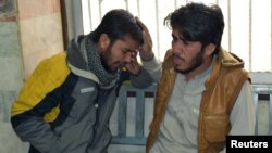 Relatives mourn a female anti-polio drive campaign worker who was shot to death by gunmen, at a hospital in Quetta, Pakistan, Jan. 18, 2018.