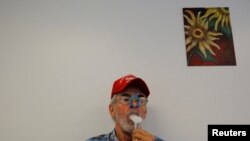 Retired coal miner James Marcum, who has black lung disease, takes a pulmonary function test at the Stone Mountain Health Center in St. Charles, Virginia, U.S., May 18, 2018.