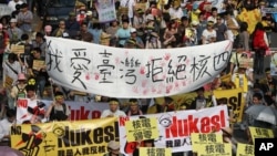 Protesters march during an anti-nuclear demonstration in Taipei, Taiwan on March 9, 2013. 