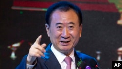 FILE - Wang Jianlin, chairman of Wanda Group, speaks during a signing ceremony for a strategic partnership between FIBA and Wanda Group in Beijing, June 16, 2016. Wanda Group has purchased Dick Clark Productions for $1 billion.