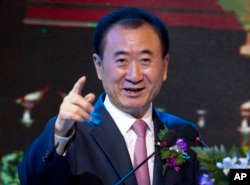 FILE - Wang Jianlin, chairman of Wanda Group, speaks during a signing ceremony for a strategic partnership between FIBA and Wanda Group in Beijing, June 16, 2016. Wanda Group has purchased Dick Clark Productions for $1 billion.