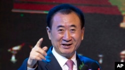  FILE - Wang Jianlin, chairman of Wanda Group, speaks during a signing ceremony for a strategic partnership between FIBA and Wanda Group in Beijing, June 16, 2016. Wang has threatened to withdraw his $10 billion in U.S. investments if Washington imposes curbs on Chinese businesses.