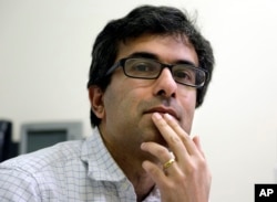 Harvard medical researcher Soumya Raychaudhuri, of Brookline, Massachusetts, pauses during an interview at Brigham and Women's Hospital in Boston, Jan. 31, 2017.