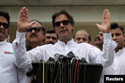 Imran Khan, chairman of Pakistan Tehreek-e-Insaf (PTI), speaks to members of media after casting his vote at a polling station during the general election in Islamabad, Pakistan, July 25, 2018.