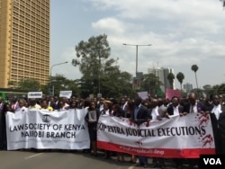 Three police officers have been arrested and another is in custody in connection with the deaths of lawyer Willie Kimani and two other men, which prompted this protest march by lawyers in Nairobi, July 6, 2016. (J. Craig/VOA)