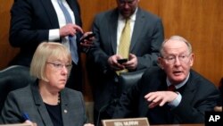  Sen. Lamar Alexander, R-Tenn., accompanied by Sen. Patty Murray, D-Wash. speaks on Capitol Hill in Washington, Jan. 31, 2017, during an executive session to discuss the nomination of Education Secretary-designate Betsy DeVos. The two are getting together again to see if they can produce legislation that could offer some relief for those struggling under the current health care plan. 