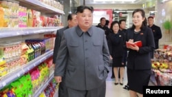 FILE - North Korean Leader Kim Jong Un visits Taesong Department Store just before its opening, in this photo released April 8, 2019, by North Korea's Korean Central News Agency.