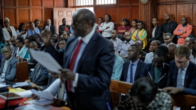 Members of the public listen as the High Court in Kenya begins hearing arguments in a case challenging parts of the penal code seen as targeting the lesbian, gay, bisexual and transgender communities, at the High Court in Nairobi, Kenya, Feb. 22, 2018.