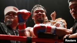  Manny Pacquiao celebrates after winning the WBA welterweight title fight against Argentinian Lucas Matthysse, July 15, 2018, in Kuala Lumpur, Malaysia.