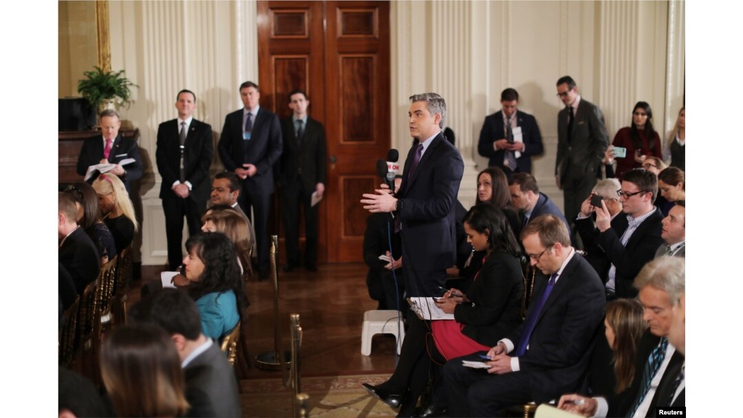 FILE - CNN reporter Jim Acosta asks a question during a news conference held by U.S. President Donald Trump at the White House in Washington, Feb. 16, 2017.
