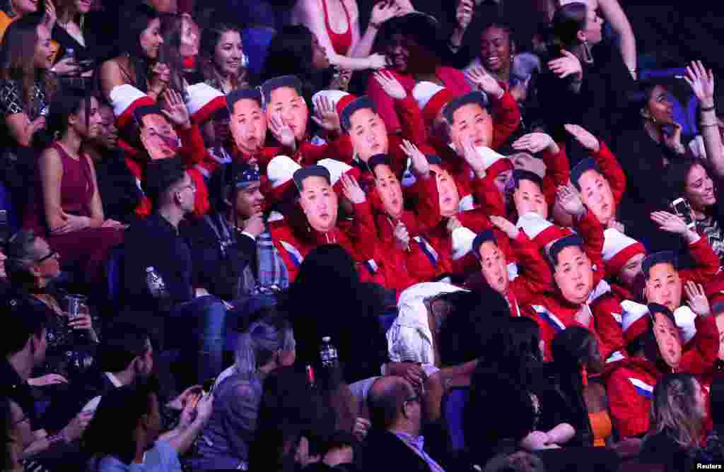 Spectators wear Kim Jong-un masks as they impersonate the North Korean cheerleaders at the Winter Olympic Games, at the Brit Awards at the O2 Arena in London, Britain, Feb. 21, 2018.