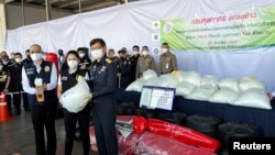 Officials show amphetamine that was hidden in punching bags bound for Australia, seized in a Thailand port, in Bangkok, Thailand. Dec. 23, 2021.