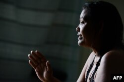 Luber Faneitte, a 56-year-old diagnosed with lung cancer, talks during a interview with AFP at her house in the San Agustin shantytown in Caracas on Nov. 10, 2017.