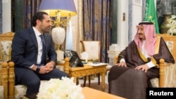 Saudi Arabia's King Salman bin Abdulaziz Al Saud meets with former Lebanese Prime Minister Saad al-Hariri in Riyadh, Saudi Arabia, Nov. 6, 2017.