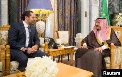 Saudi Arabia's King Salman bin Abdulaziz al-Saud meets with former Lebanese Prime Minister Saad al-Hariri in Riyadh, Saudi Arabia, Nov. 6, 2017.