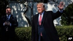 President Donald Trump waves as he leaves South Lawn of the White House, April 10, 2018.