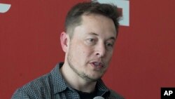 FILE - Tesla Motors Inc., CEO Elon Musk discusses the company's new Gigafactory in Sparks, Nevada, July 26, 2016. 