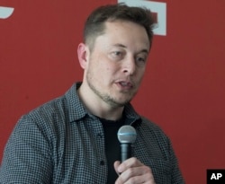 FILE - Tesla Motors Inc., CEO Elon Musk discusses the company's new Gigafactory in Sparks, Nevada, July 26, 2016.