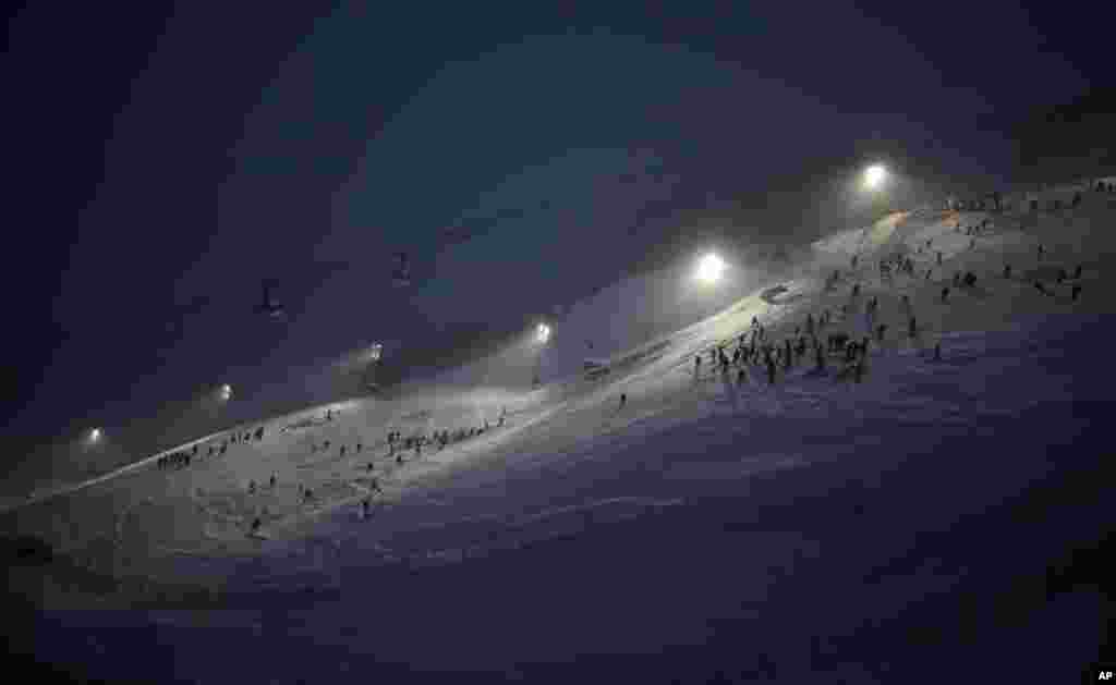 Race inspectors check out the course ahead of an alpine ski, men&#39;s World Cup slalom, in Val D&#39;Isere, France.