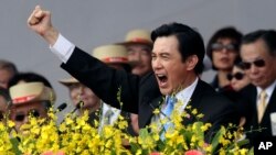 Taiwan's President Ma Ying-jeou cheers with the audience during National Day celebrations in front of the Presidential Office in Taipei, Taiwan, Oct. 10, 2013.