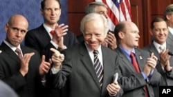Senator Joseph Lieberman, center, gestures during a news conference pushing for the repeal of the military 'Don't Ask Don't Tell' rule, Capitol Hill, Washington, DC, 18 November 2010