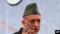 Afghan President Hamid Karzai speaks during a teachers' graduation ceremony in Kabul March 30, 2011.