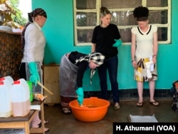 An organic soap making session is attended by women living with albinism in Nansana, Wakiso district in Uganda.
