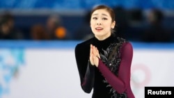 러시아 소치 동계올림픽에 출전한 한국 김연아 선수가 20일 여자 피겨스케이팅 경기를 마친 후 감격스러워 하고 있다.