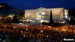 Demonstrators protest in front of parliament, Athens, July 17, 2013.