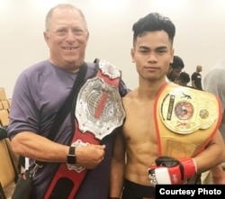 Theo Rlayang shows off his championship belt earned in the 145-pound weight class division. (Photo courtesy of Theo Rlayang)