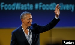 Former U.S. President Barack Obama waves after speaking at the Global Food Innovation Summit in Milan, Italy, May 9, 2017.