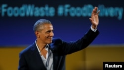 Former U.S. President Barack Obama waves after speaking at the Global Food Innovation Summit in Milan, Italy, May 9, 2017. 