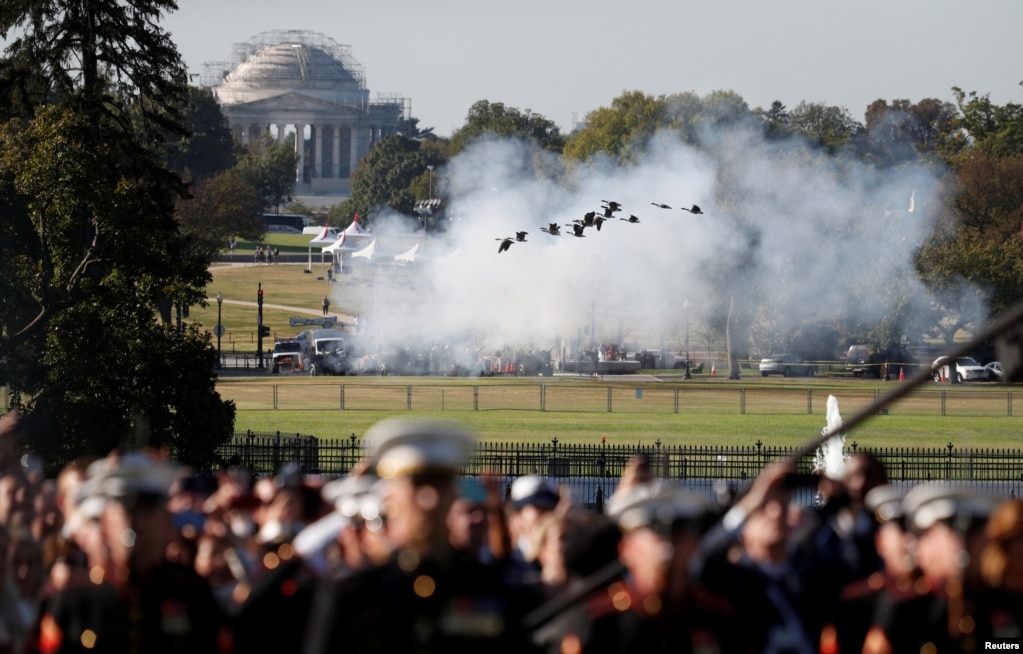 Geese take flight in front of the Jefferson Memorial as guns are fired during an official arrival ceremony for Australia's Prime Minister Scott Morrison by U.S. President Donald Trump on the South Lawn of the White House.